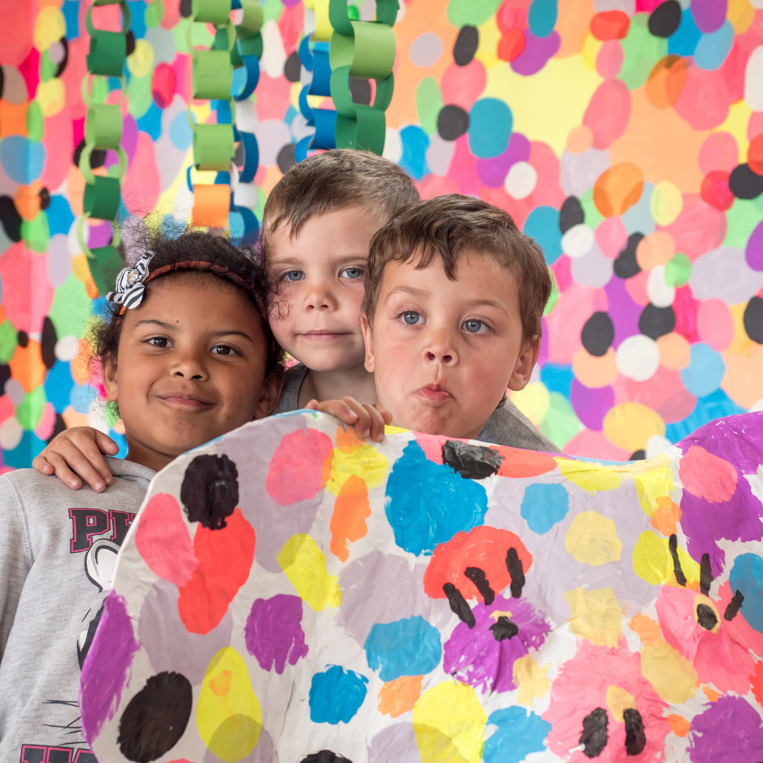 Kids in polka dot covered Pom Pom space